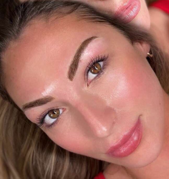 Women with defined microbladed brows